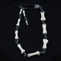 Lupine Gaze: Modern Silver and Wolf Tail Bone Brooch with Black Diamond Eyes