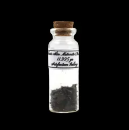 11.995 g Sikhote-Alin meteorite in sealed bottle, Russia