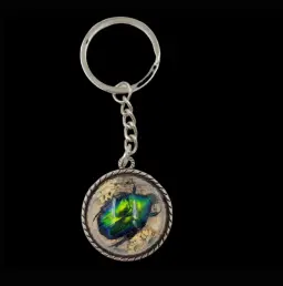 keychain featuring a real metallic-green jewel beetle