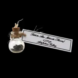 1.779 g Sikhote-Alin meteorite in sealed round bottle, Russia