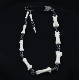 Lupine Gaze: Modern Silver and Wolf Tail Bone Brooch with Black Diamond Eyes
