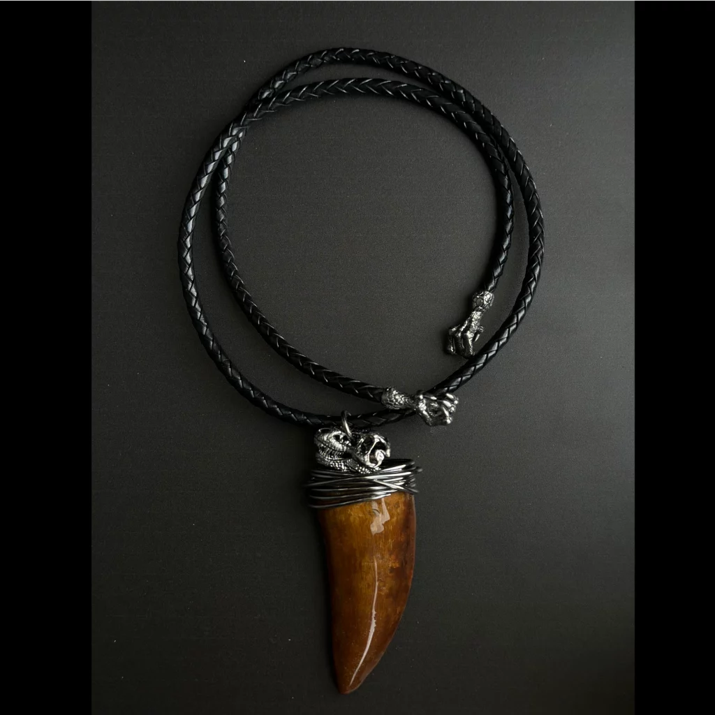 Silver pendant with Carcharodontosaurus tooth