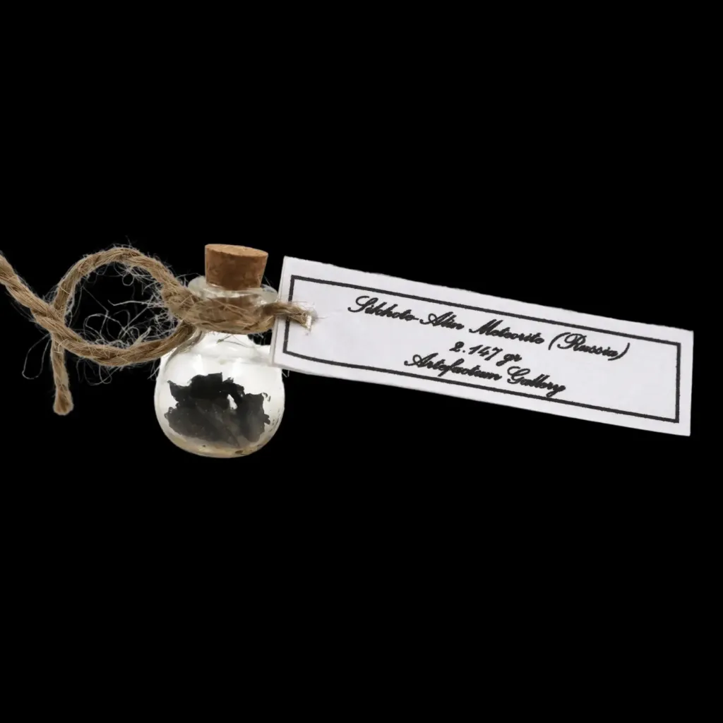 2.147 g Sikhote-Alin meteorite in sealed round bottle - preview photo 1123