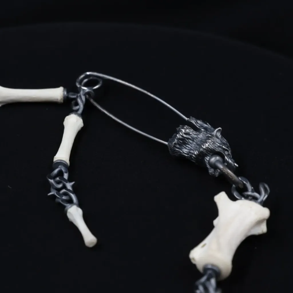Lupine Gaze: Modern Silver and Wolf Tail Bone Brooch with Black Diamond Eyes - preview photo 3123