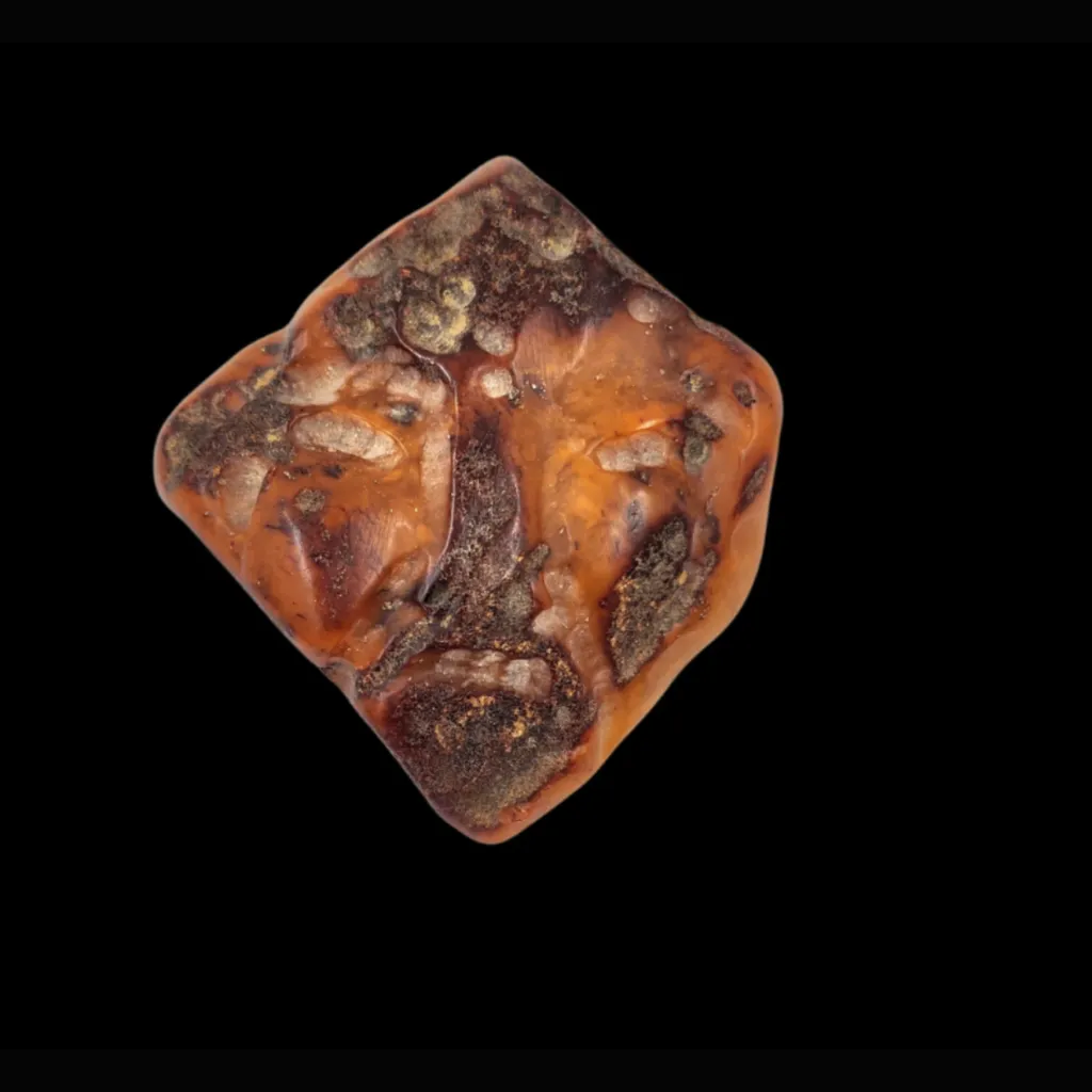 Amber with an Archaic Defective Face – The Ancient Expression of Time